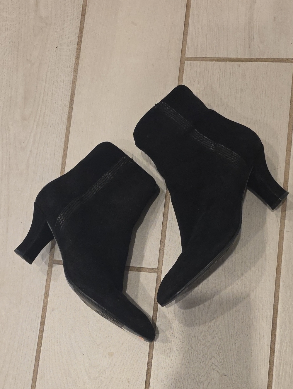 Thierry Rabotin ankle boots feature a black suede upper with a stylish textured